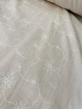 Linen-Textured White Floral Embroidered Scalloped Fabric